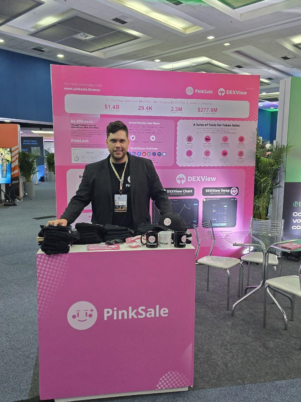 Oliver at the PinkSale booth during a Web3 event.
